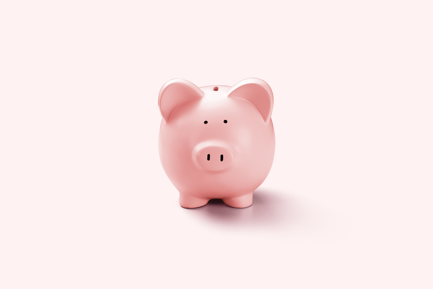 Bild einer Spardose in Form eines pinken Schweins.